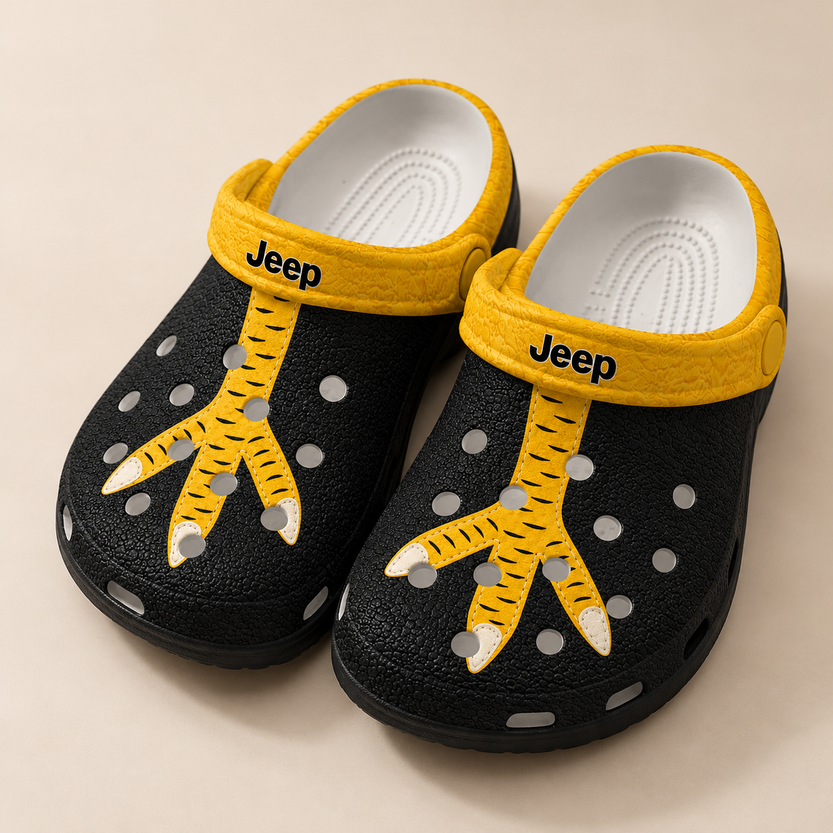 Mockup of black Jeep Chicken Feet Clogs with flat printed yellow chicken-foot artwork
