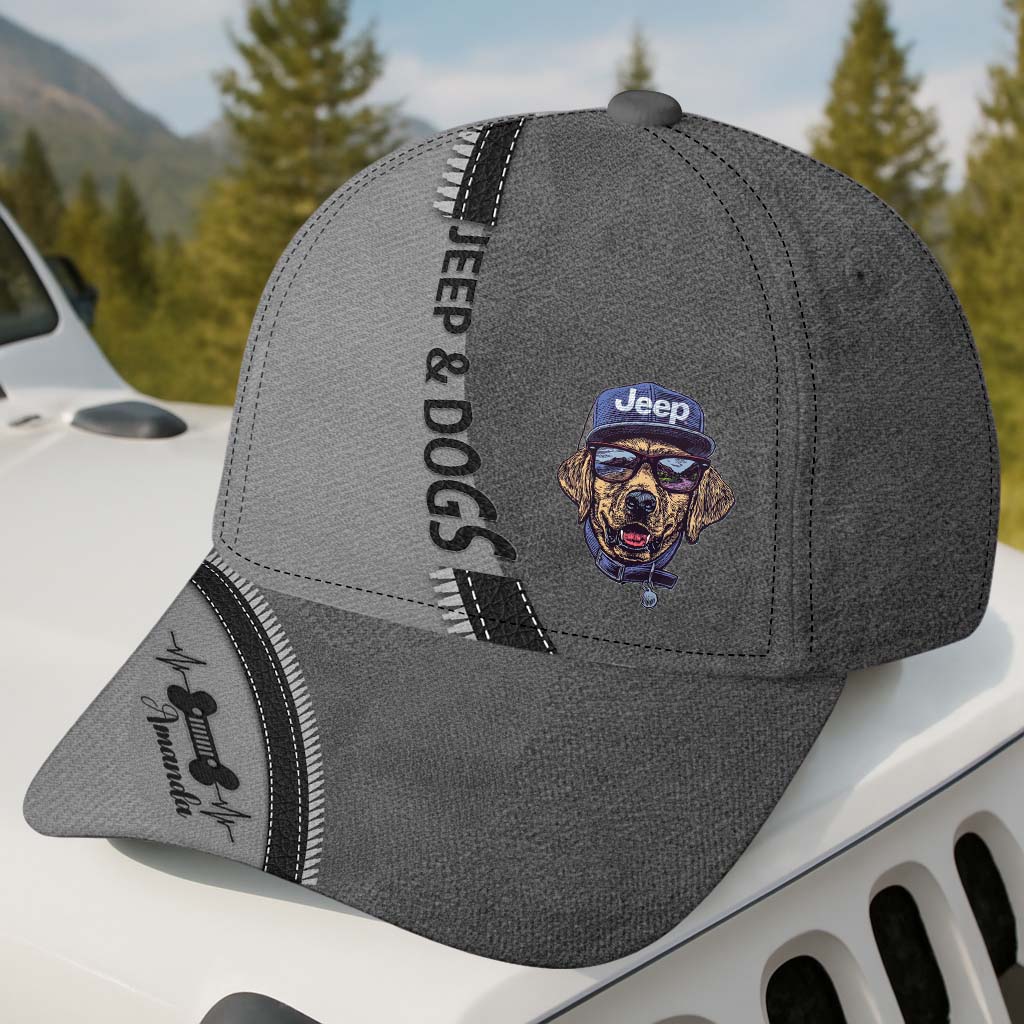 Gray cap with Jeep and Dogs logo on a vehicle with a forest background